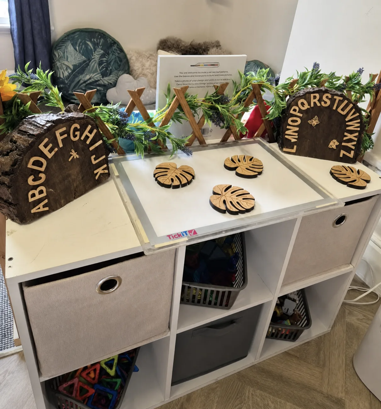 A natural materials activity with wooden alphabet pieces and tactile learning resources